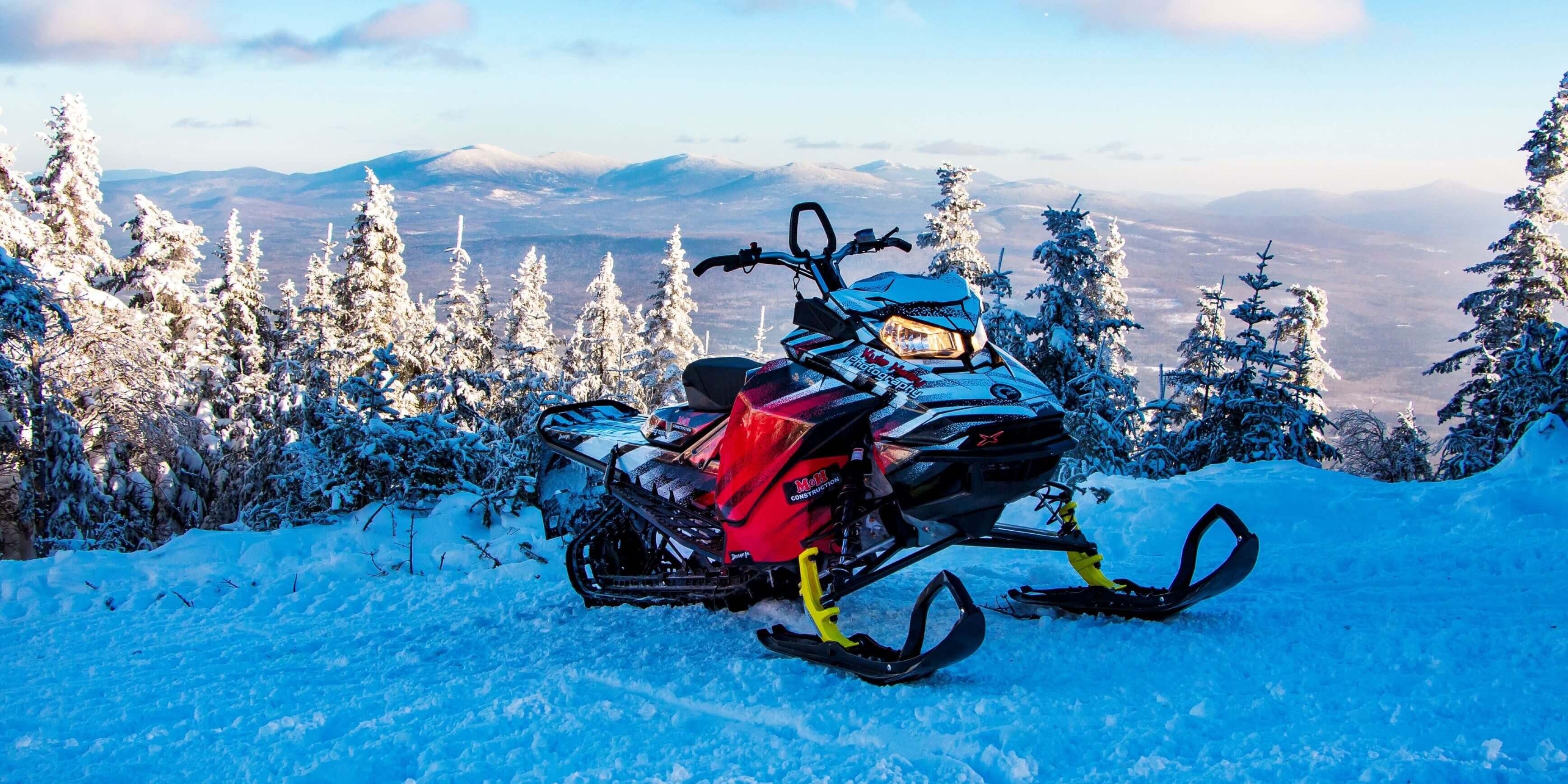 Snowmobile on a Mountain Top trail in the Rangeleyy Lakes region of Maine